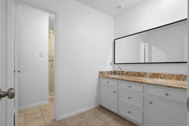310 W Fair Harbor Ln, Houston, TX 77079 - bathroom with vanity, a shower with shower door, and tile patterned floors
