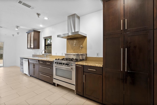 310 W Fair Harbor Ln, Houston, TX 77079 - kitchen featuring island exhaust hood, high end stove, backsplash, dishwasher, and dark brown cabinetry