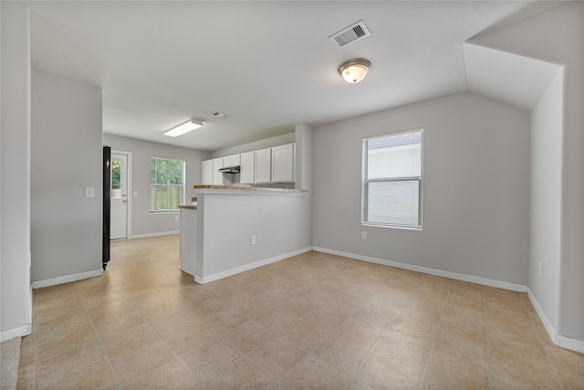 9826 Orchid Spring Ln, Houston, TX 77044 - kitchen with white cabinetry and baseboards