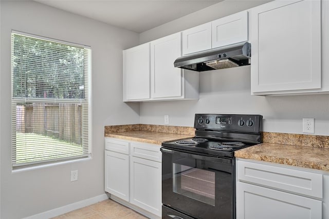 9826 Orchid Spring Ln, Houston, TX 77044 - kitchen featuring black / electric stove, under cabinet range hood, white cabinets, and light tile patterned floors