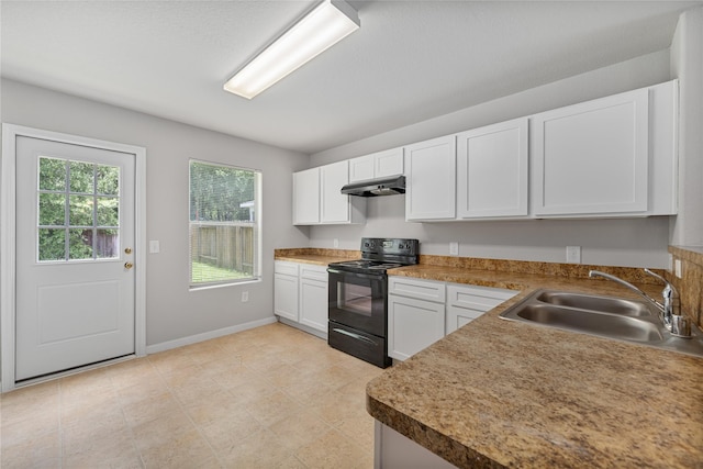 9826 Orchid Spring Ln, Houston, TX 77044 - kitchen featuring black electric range oven, under cabinet range hood, and white cabinets