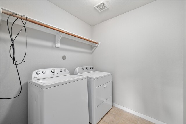 9826 Orchid Spring Ln, Houston, TX 77044 - washroom featuring independent washer and dryer and baseboards