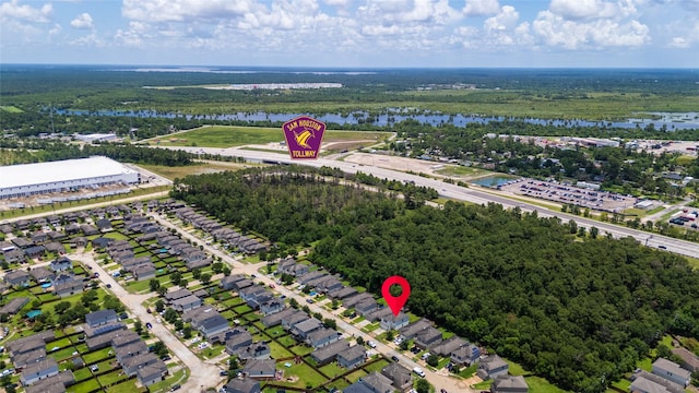 9826 Orchid Spring Ln, Houston, TX 77044 - aerial view of a nearby body of water and a forest