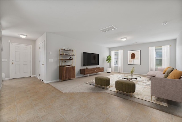 9826 Orchid Spring Ln, Houston, TX 77044 - living room with plenty of natural light and light tile patterned floors