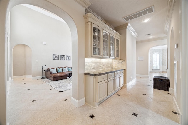 718 Marywood Chase, Houston, TX 77079 - hall with arched walkways, crown molding, light tile patterned flooring, and recessed lighting