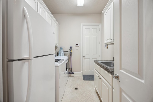 718 Marywood Chase, Houston, TX 77079 - laundry room featuring washer / dryer and light tile patterned floors