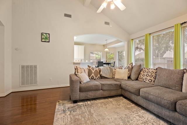 4146 S Webber Dr, Pearland, TX 77584 - living room featuring arched walkways, wood finished floors, a ceiling fan, beamed ceiling, and high vaulted ceiling