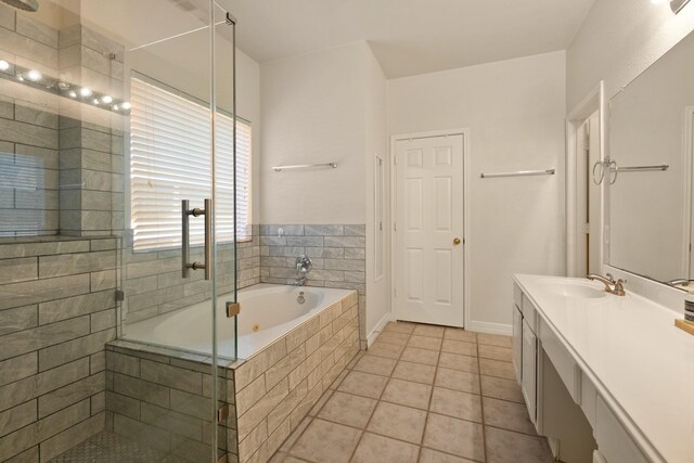 4146 S Webber Dr, Pearland, TX 77584 - full bathroom with vanity, a garden tub, a shower stall, and tile patterned floors