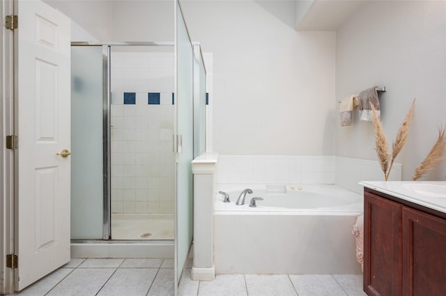 13703 Naples Park Ln, Houston, TX 77070 - full bathroom featuring a bath, tile patterned floors, a shower stall, and vanity