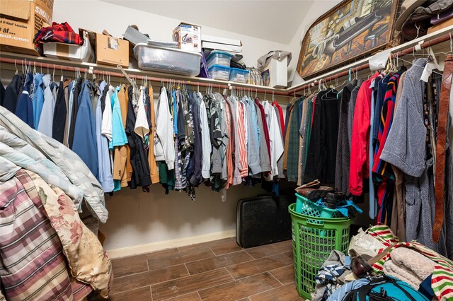 13703 Naples Park Ln, Houston, TX 77070 - walk in closet with wood tiled floors and vaulted ceiling