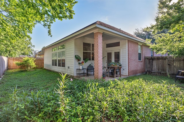13703 Naples Park Ln, Houston, TX 77070 - back of house featuring a fenced backyard, a patio, and brick siding