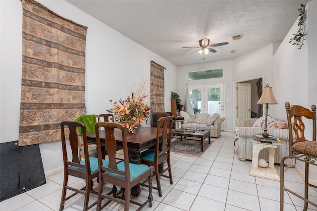 13703 Naples Park Ln, Houston, TX 77070 - dining room with light tile patterned flooring, a ceiling fan, and a textured ceiling