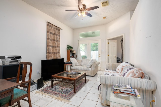 13703 Naples Park Ln, Houston, TX 77070 - living room featuring light tile patterned floors, a ceiling fan, and a textured ceiling