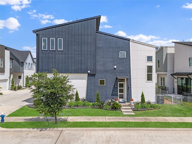 9809 Blissful Prairie Ln, Houston, TX 77080 - contemporary home with a garage, board and batten siding, and concrete driveway
