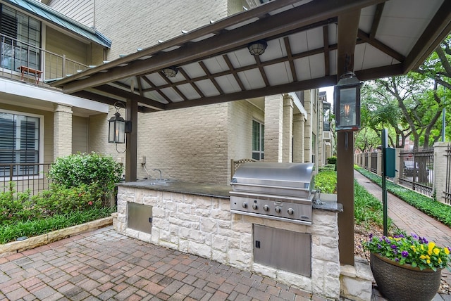 2700 Revere St Unit 147, Houston, TX 77098 - view of patio / terrace featuring exterior kitchen