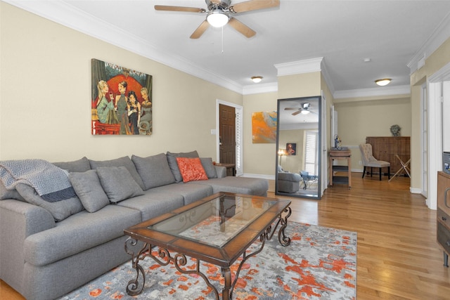 2700 Revere St Unit 147, Houston, TX 77098 - living area with ceiling fan, ornamental molding, and light wood finished floors
