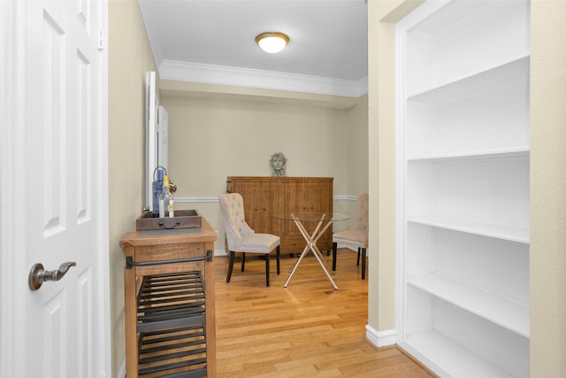 2700 Revere St Unit 147, Houston, TX 77098 - sitting room featuring crown molding and light wood-type flooring