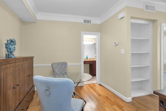 2700 Revere St Unit 147, Houston, TX 77098 - home office featuring light wood-style floors, ornamental molding, and built in shelves