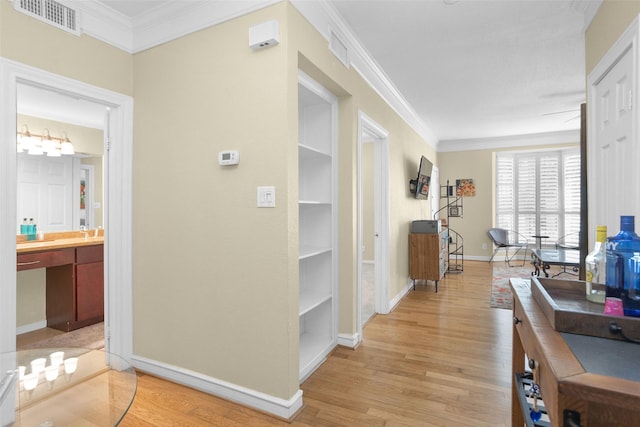 2700 Revere St Unit 147, Houston, TX 77098 - corridor with ornamental molding and light wood-style flooring