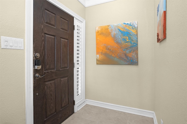 2700 Revere St Unit 147, Houston, TX 77098 - foyer featuring baseboards and tile patterned flooring
