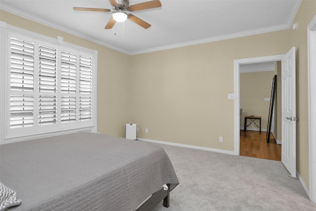 2700 Revere St Unit 147, Houston, TX 77098 - bedroom featuring crown molding, carpet floors, and a ceiling fan