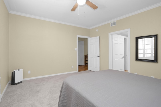 2700 Revere St Unit 147, Houston, TX 77098 - carpeted bedroom with crown molding and ceiling fan