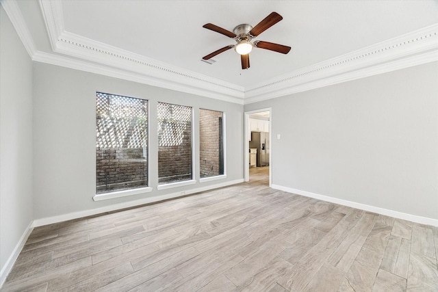 11602 Aspenway Dr, Houston, TX 77070 - empty room with crown molding, a ceiling fan, a raised ceiling, and light wood-type flooring