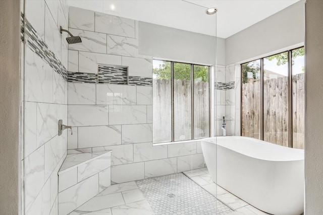 11602 Aspenway Dr, Houston, TX 77070 - bathroom featuring marble finish flooring, a soaking tub, and tiled shower