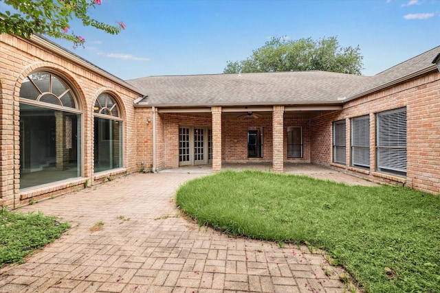 11602 Aspenway Dr, Houston, TX 77070 - rear view of house featuring brick siding, a shingled roof, a patio, and french doors