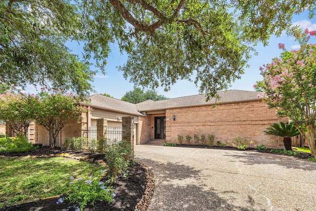 11602 Aspenway Dr, Houston, TX 77070 - ranch-style home with driveway, brick siding, and a garage