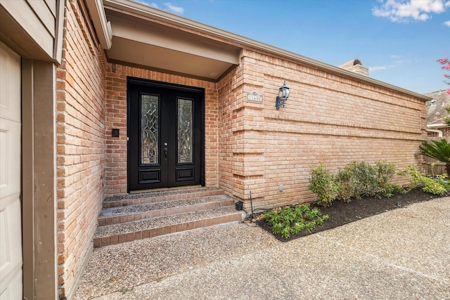 11602 Aspenway Dr, Houston, TX 77070 - doorway to property featuring brick siding and french doors