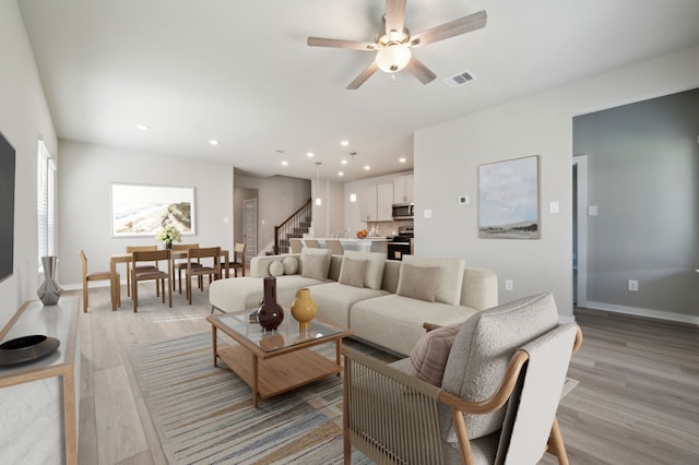 8615 Lake Groove Ln, Baytown, TX 77523 - living area featuring light wood-style floors, ceiling fan, and recessed lighting