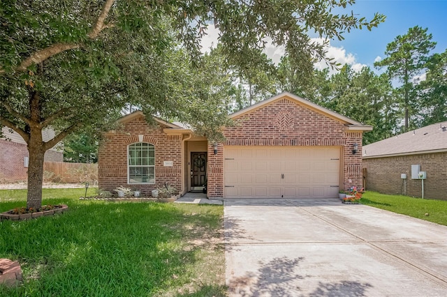 30914 Sweetwater Cir, Magnolia, TX 77355 - view of front of house with brick siding, driveway, and a garage