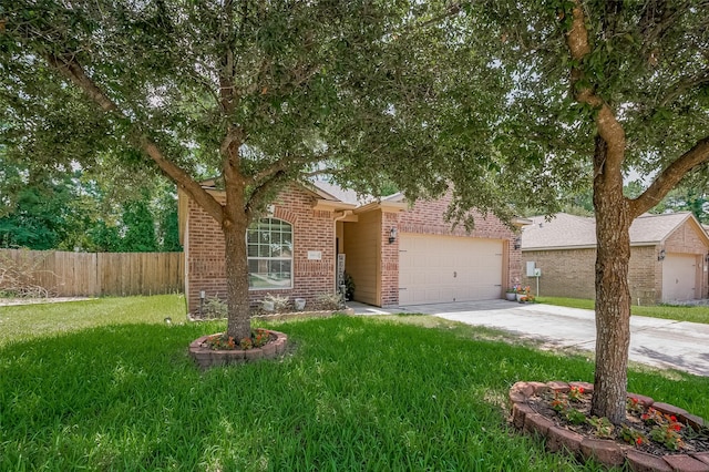 30914 Sweetwater Cir, Magnolia, TX 77355 - obstructed view of property with brick siding, concrete driveway, and an attached garage
