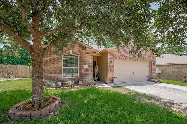 30914 Sweetwater Cir, Magnolia, TX 77355 - view of front of home with brick siding, an attached garage, and driveway