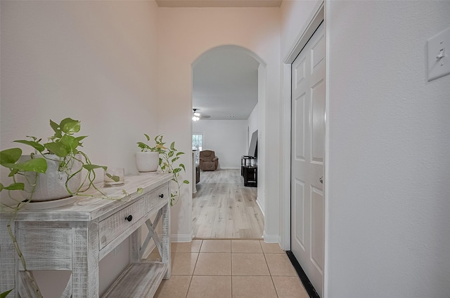 30914 Sweetwater Cir, Magnolia, TX 77355 - corridor featuring arched walkways and light tile patterned flooring