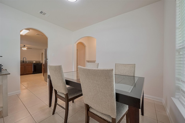 30914 Sweetwater Cir, Magnolia, TX 77355 - dining room featuring arched walkways and light tile patterned floors