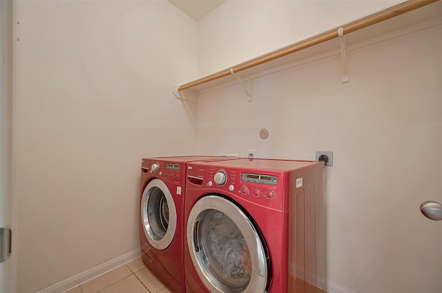 30914 Sweetwater Cir, Magnolia, TX 77355 - washroom with independent washer and dryer and light tile patterned flooring