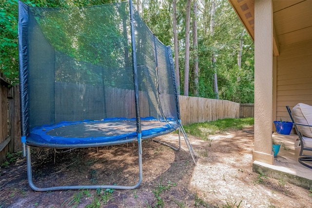 30914 Sweetwater Cir, Magnolia, TX 77355 - fenced backyard featuring a trampoline