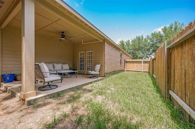 30914 Sweetwater Cir, Magnolia, TX 77355 - fenced backyard featuring a ceiling fan, a patio area, french doors, and an outdoor hangout area