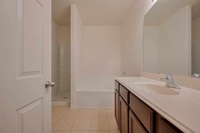 30914 Sweetwater Cir, Magnolia, TX 77355 - full bath with vanity, a garden tub, tile patterned flooring, and a stall shower
