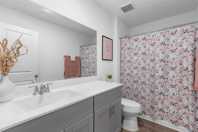 1100 Greenshank Dr, Katy, TX 77493 - full bathroom featuring vanity, wood finished floors, and a shower with curtain