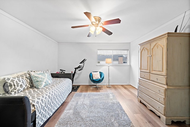 10333 Longmont Dr Unit 35/3, Houston, TX 77042 - bedroom with ornamental molding, light wood-type flooring, and a ceiling fan