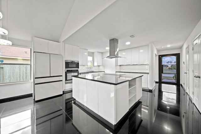 2015 Treasure Mountain Dr, Spring, TX 77388 - kitchen featuring island exhaust hood, modern cabinets, white cabinets, decorative backsplash, and recessed lighting