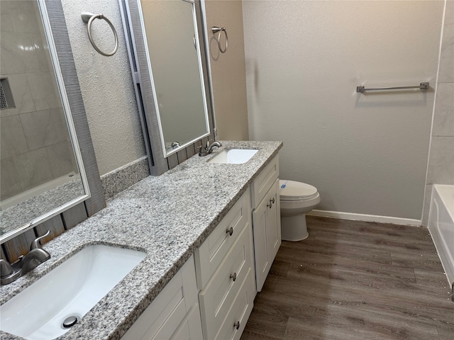 10052 Sharpton Dr, Houston, TX 77038 - bathroom featuring double vanity, wood finished floors, a shower, and a bath