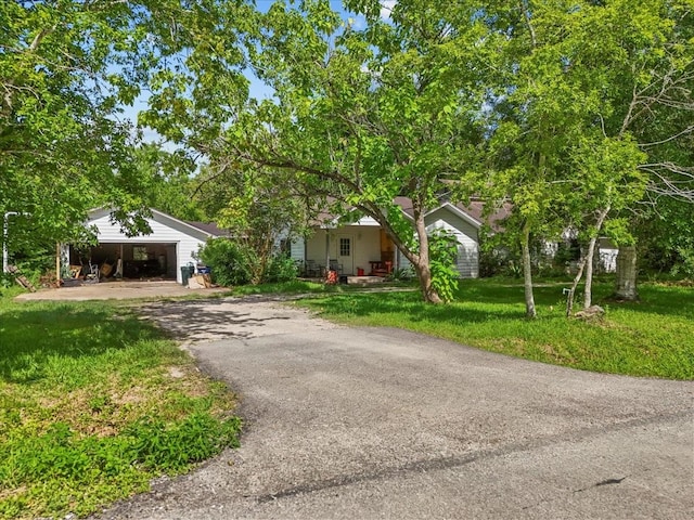 3061 Mary Ln, Dickinson, TX 77539 - view of front of home featuring driveway, a front lawn, and an attached garage
