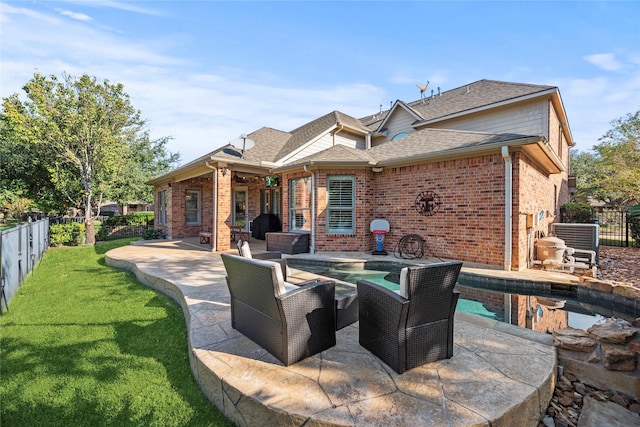 12207 Johns Enterprise Ct, Cypress, TX 77433 - back of property with a patio area, brick siding, a shingled roof, and a fenced backyard