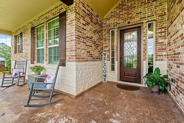 4419 Lea Ln, Fulshear, TX 77406 - view of exterior entry with covered porch and brick siding