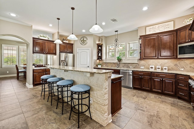 4419 Lea Ln, Fulshear, TX 77406 - kitchen with stainless steel appliances, backsplash, a kitchen breakfast bar, a center island with sink, and recessed lighting