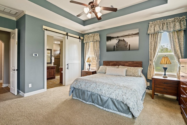 4419 Lea Ln, Fulshear, TX 77406 - carpeted bedroom with a tray ceiling, ornamental molding, a barn door, connected bathroom, and a ceiling fan